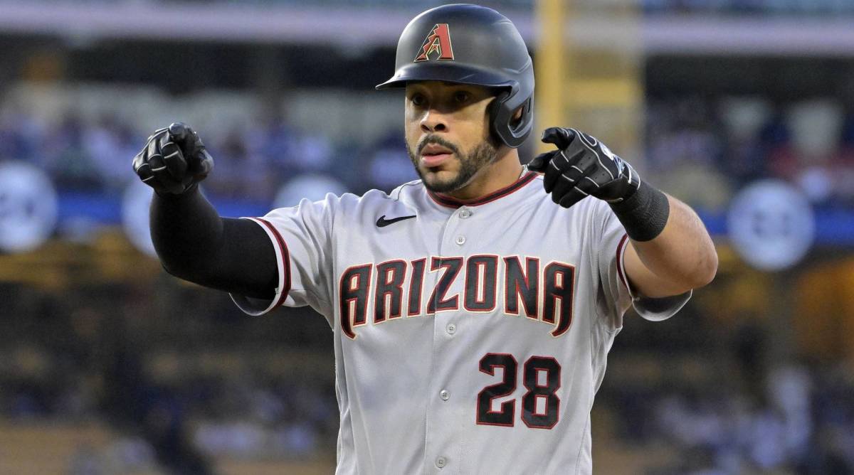 Diamondbacks outfielder Tommy Pham signals to the dugout during a game vs. the Dodgers.